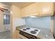 View of kitchen stove and granite countertop at 8446 N 34Th Dr, Phoenix, AZ 85051