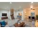 Open-concept living area with stairs, featuring modern decor and a seamless flow to the dining area at 8446 N 34Th Dr, Phoenix, AZ 85051
