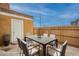 Outdoor patio featuring a dining set and a wooden fence, perfect for entertaining or relaxing at 8446 N 34Th Dr, Phoenix, AZ 85051