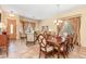 Elegant dining room with a large table and access to the living room at 8836 W Midway Ave, Glendale, AZ 85305