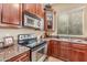 Well-equipped kitchen with stainless steel appliances and granite counters at 8836 W Midway Ave, Glendale, AZ 85305