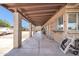 Covered patio with concrete flooring, offering a shaded outdoor space at 9469 N 50Th Dr, Glendale, AZ 85302