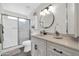 Updated bathroom with white vanity, modern fixtures and a walk-in shower at 9469 N 50Th Dr, Glendale, AZ 85302