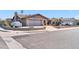 House exterior showcasing a two-car garage and front yard at 9469 N 50Th Dr, Glendale, AZ 85302