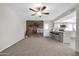 Living room features a stone fireplace and kitchen access at 9469 N 50Th Dr, Glendale, AZ 85302