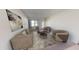 Living room with two armchairs and a neutral color scheme at 9745 W Agora Ln, Tolleson, AZ 85353