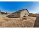 House backyard view with unlandscaped area at 10036 W Parkway Rd, Tolleson, AZ 85353