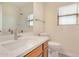 Bathroom with single sink vanity, shower, and toilet at 10036 W Parkway Rd, Tolleson, AZ 85353