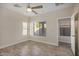 Bright bedroom with tile flooring and ceiling fan at 10036 W Parkway Rd, Tolleson, AZ 85353