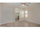 Bright bedroom with wood-look tile flooring and ensuite bathroom access at 10036 W Parkway Rd, Tolleson, AZ 85353