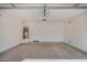 Spacious garage with an attached door and water heater at 10036 W Parkway Rd, Tolleson, AZ 85353