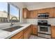 Updated kitchen featuring stainless steel appliances and quartz countertops at 10036 W Parkway Rd, Tolleson, AZ 85353