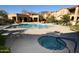 Community pool and spa with lounge chairs at 10419 N 10Th Pl # 2, Phoenix, AZ 85020