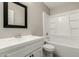 Clean bathroom with a bathtub, sink, and shower at 10436 W Devonshire Ave, Phoenix, AZ 85037