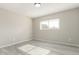 Simple bedroom with window and wood-look floors at 10436 W Devonshire Ave, Phoenix, AZ 85037