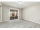 Bright bedroom with sliding glass door leading to a patio at 10436 W Devonshire Ave, Phoenix, AZ 85037