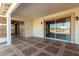 Spacious tiled patio with sliding glass doors at 10436 W Devonshire Ave, Phoenix, AZ 85037