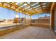 Relaxing screened porch with tiled floor and pergola at 10436 W Devonshire Ave, Phoenix, AZ 85037