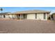 Large backyard with gravel, patio cover, and seating area at 10737 W Hutton Dr, Sun City, AZ 85351