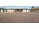 Sun-drenched backyard featuring a covered patio and gravel landscaping at 10737 W Hutton Dr, Sun City, AZ 85351