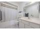 Clean bathroom with a shower/tub combo and updated vanity at 10737 W Hutton Dr, Sun City, AZ 85351