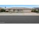 Ranch style home with attached garage and well-manicured lawn at 10737 W Hutton Dr, Sun City, AZ 85351