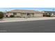 Ranch style home with attached garage and desert landscaping at 10737 W Hutton Dr, Sun City, AZ 85351