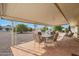 Covered patio with seating area, perfect for outdoor dining at 10737 W Hutton Dr, Sun City, AZ 85351