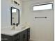 Modern bathroom with gray vanity and floating sink at 11615 S 211Th Ln, Buckeye, AZ 85326