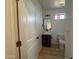 Modern bathroom with dark vanity and contemporary lighting at 11615 S 211Th Ln, Buckeye, AZ 85326