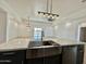 Kitchen island with sink, stainless steel appliances, and quartz countertop at 11615 S 211Th Ln, Buckeye, AZ 85326