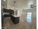 Modern kitchen with large island and open floor plan at 11615 S 211Th Ln, Buckeye, AZ 85326