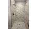 Clean shower with marble-look tile and black fixtures at 11615 S 211Th Ln, Buckeye, AZ 85326