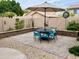 Inviting patio area featuring outdoor dining table and seating with umbrella at 1233 E Redfield Rd, Phoenix, AZ 85022