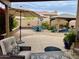 Inviting outdoor patio area with seating, umbrellas, dining table and gazebo at 1233 E Redfield Rd, Phoenix, AZ 85022