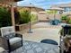 An inviting outdoor patio with comfortable seating, umbrellas, and landscaped surroundings at 1233 E Redfield Rd, Phoenix, AZ 85022