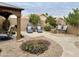 Inviting backyard with desert landscaping, seating area, and outdoor grill, perfect for relaxation at 1233 E Redfield Rd, Phoenix, AZ 85022