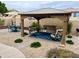 Backyard featuring gazebo with comfortable seating and dining table at 1233 E Redfield Rd, Phoenix, AZ 85022