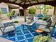 Comfortable outdoor seating area with plush cushions under a shaded gazebo at 1233 E Redfield Rd, Phoenix, AZ 85022