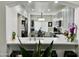 Modern kitchen with white marble countertops and stainless appliances connects to a sunny breakfast nook at 1233 E Redfield Rd, Phoenix, AZ 85022