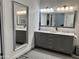 The main bathroom features double sinks, large mirrors, and modern subway tile at 1233 E Redfield Rd, Phoenix, AZ 85022