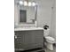 Beautifully renovated bathroom features a single sink, subway tile, and a glass-enclosed shower at 1233 E Redfield Rd, Phoenix, AZ 85022