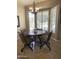 Breakfast nook with a round table and four chairs, near a window at 14226 W Via Montoya --, Sun City West, AZ 85375