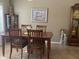 Bright dining room features a wood table with four chairs and decorative accents at 14226 W Via Montoya --, Sun City West, AZ 85375