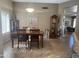 Dining area with wood table and chairs, and a grandfather clock at 14226 W Via Montoya --, Sun City West, AZ 85375