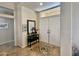 Bright entryway with tile flooring, double doors, and a console table at 14226 W Via Montoya --, Sun City West, AZ 85375