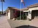 Well-maintained home exterior with red bougainvillea and flag at 14226 W Via Montoya --, Sun City West, AZ 85375