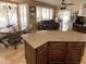 Island kitchen with granite countertops and a breakfast bar at 14226 W Via Montoya --, Sun City West, AZ 85375