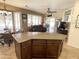 Kitchen island with seating overlooks the living room at 14226 W Via Montoya --, Sun City West, AZ 85375