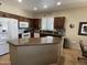 Spacious kitchen with an island, ample cabinetry and granite countertops at 14226 W Via Montoya --, Sun City West, AZ 85375